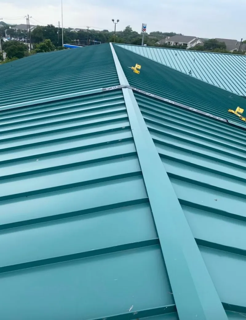 Green commercial metal roof ridge and valley for Metal Roof Repair in Akron