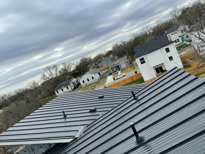 Standing seam metal roof panels with vents for Skylight Repair in Akron